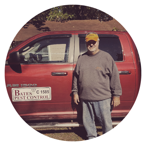 Hubert Bates standing in front of his work truck